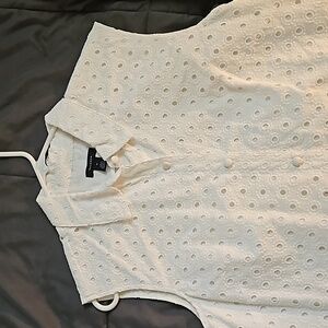 White sleeveless eyelet dress